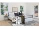 Sun-filled main bedroom featuring stylish decor, a cozy rug, and large windows at 906 Mcdaniel St, Atlanta, GA 30310