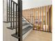Elegant staircase with wood and black railings leads to an inviting living space at 906 Mcdaniel St, Atlanta, GA 30310