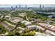 Panoramic aerial view showcases city skyline surrounded by lush green landscape and neighborhood at 245 N Highland Ne Ave # 220, Atlanta, GA 30307
