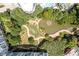 An aerial shot displaying a serene pond and green space within a well-maintained community at 245 N N Highland Ne Ave # 220, Atlanta, GA 30307