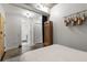 Bedroom entrance showcases open design; a concrete ceiling with a patterned rug and unique wall art at 245 N N Highland Ne Ave # 220, Atlanta, GA 30307