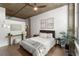 Modern bedroom features neutral decor, a ceiling fan, and natural light, creating a serene atmosphere at 245 N N Highland Ne Ave # 220, Atlanta, GA 30307