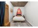 Bedroom features bohemian style and concrete ceiling with unique lighting, canopy bed and patterned rug at 245 N N Highland Ne Ave # 220, Atlanta, GA 30307