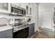 Kitchen featuring a stainless steel range and oven combo, modern cabinetry, and ample counter space at 245 N N Highland Ne Ave # 220, Atlanta, GA 30307