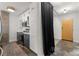 Contemporary kitchen with stainless steel appliances and a view towards the entryway at 245 N N Highland Ne Ave # 220, Atlanta, GA 30307