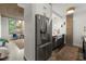 Charming kitchen with stainless steel refrigerator, apron sink, and modern faucet at 245 N N Highland Ne Ave # 220, Atlanta, GA 30307