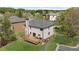 Aerial view of a home showcasing the backyard, deck, and surrounding neighborhood at 2625 Cross Springs Dr, Cumming, GA 30041