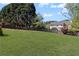Spacious backyard featuring a well-kept lawn and mature trees at 2625 Cross Springs Dr, Cumming, GA 30041
