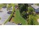 Expansive backyard featuring lush lawn, mature trees, wood fence, and a play area for outdoor fun at 2625 Cross Springs Dr, Cumming, GA 30041