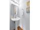 Charming half bath with a pedestal sink, modern mirror, and a fresh, clean design at 2625 Cross Springs Dr, Cumming, GA 30041