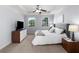 Cozy bedroom with a plush bed, dresser, and bright windows that let in natural light at 2625 Cross Springs Dr, Cumming, GA 30041