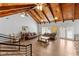 Spacious clubhouse featuring vaulted wood beam ceiling, wood laminate flooring, and ample seating at 2625 Cross Springs Dr, Cumming, GA 30041