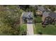Two-story home with a well-manicured front lawn, long driveway, and attached two-car garage at 2625 Cross Springs Dr, Cumming, GA 30041