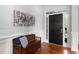 Welcoming entrance showcasing a stylish front door, decorative art, and a charming wooden bench at 2625 Cross Springs Dr, Cumming, GA 30041