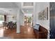 Bright foyer with hardwood floors, elegant trim, and a view into the dining and living areas at 2625 Cross Springs Dr, Cumming, GA 30041