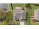 Aerial view of the home showing the roof and backyard deck with seating, all privately enclosed by a fence at 2625 Cross Springs Dr, Cumming, GA 30041