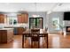 Bright and airy kitchen and dining area featuring backyard views, a fireplace, and ample lighting at 2625 Cross Springs Dr, Cumming, GA 30041