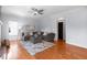 Bright living room featuring a comfortable sectional sofa, hardwood floors and a ceiling fan at 2625 Cross Springs Dr, Cumming, GA 30041