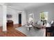 Comfortable living room featuring hardwood floors, stylish seating, and ample natural light at 2625 Cross Springs Dr, Cumming, GA 30041