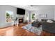 Comfortable living room with a fireplace, hardwood floors, and a cozy seating arrangement at 2625 Cross Springs Dr, Cumming, GA 30041