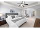 Spacious main bedroom with neutral walls, tray ceiling, and a sitting area that provides a serene retreat at 2625 Cross Springs Dr, Cumming, GA 30041