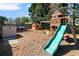 Backyard playground with slide, swings, playhouse, and trampoline for outdoor fun at 2625 Cross Springs Dr, Cumming, GA 30041