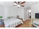 This bright bedroom boasts hardwood floors, ceiling fan, and an ensuite bathroom with updated fixtures at 305 Summit North Ne Dr # 305, Atlanta, GA 30324