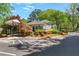 Beautifully landscaped entrance features manicured gardens, a gated entry, and convenient parking access at 305 Summit North Ne Dr # 305, Atlanta, GA 30324