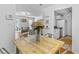 Charming dining area with rustic wooden table and view into living room and kitchen at 305 Summit North Ne Dr # 305, Atlanta, GA 30324