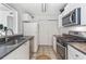 Well-maintained kitchen features stainless steel appliances and tiled floors at 305 Summit North Ne Dr # 305, Atlanta, GA 30324