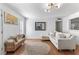 Cozy living room features hardwood floors, modern lighting, and a comfortable sectional sofa at 305 Summit North Ne Dr # 305, Atlanta, GA 30324
