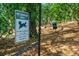 Community pet exercise area surrounded by nature, provides a convenient space for pet owners at 305 Summit North Ne Dr # 305, Atlanta, GA 30324