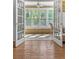 Inviting sunroom filled with natural light, multiple windows, and access to the outdoors at 305 Summit North Ne Dr # 305, Atlanta, GA 30324