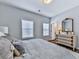 Cozy bedroom with neutral bedding, white walls, wood floors, and a classic dresser at 6380 Cortland Walk, Alpharetta, GA 30005