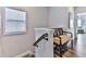 Cozy hallway featuring wood floors, natural lighting, and a charming bench at 6380 Cortland Walk, Alpharetta, GA 30005