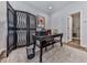Stylish office space with a modern desk, decorative screen, and ample natural light, ideal for remote work at 6380 Cortland Walk, Alpharetta, GA 30005