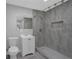 Updated bathroom with gray shower tile and white sink cabinet at 3326 Chappel Lane, Peachtree Corners, GA 30360