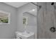 Bright bathroom showcasing a shower with gray tile, a modern vanity with sink, and a large mirror reflecting natural light at 3326 Chappel Lane, Peachtree Corners, GA 30360