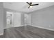 Spacious bedroom with gray walls, gray floors, and view to an en suite bath at 3326 Chappel Lane, Peachtree Corners, GA 30360