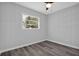 Bright, airy bedroom featuring neutral walls, a ceiling fan, and stylish gray floors at 3326 Chappel Lane, Peachtree Corners, GA 30360