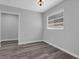 Bright bedroom showcasing gray vinyl floors and a doorway to another room, offering comfort and style at 3326 Chappel Lane, Peachtree Corners, GA 30360