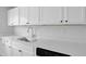 Close-up on stainless steel sink, white countertop and cabinetry at 3326 Chappel Lane, Peachtree Corners, GA 30360