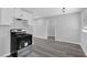 Modern kitchen featuring a stainless steel range and hood at 3326 Chappel Lane, Peachtree Corners, GA 30360