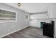 Well-lit kitchen features wood flooring, white cabinets, and modern appliances at 3326 Chappel Lane, Peachtree Corners, GA 30360