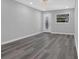 Comfortable living room with gray vinyl floors, a decorative front door, and recessed lighting for a modern touch at 3326 Chappel Lane, Peachtree Corners, GA 30360