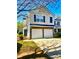 Beautiful two-story home featuring a brick-accented two-car garage and well-maintained landscaping at 5485 Mountain Top Pl, Cumming, GA 30041