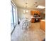 Eat-in kitchen featuring warm cabinetry, stainless steel appliances and sliding glass doors to the exterior at 5485 Mountain Top Pl, Cumming, GA 30041