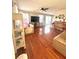 Open living room with hardwood floors, natural light, and neutral paint at 5485 Mountain Top Pl, Cumming, GA 30041