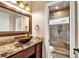 Stylish bathroom with vessel sink, granite countertop, and a modern tiled walk-in shower at 850 Highland Bend Cv, Alpharetta, GA 30022