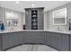 Beautiful bathroom featuring double vanities, stylish gray cabinetry, and marble floors at 850 Highland Bend Cv, Alpharetta, GA 30022